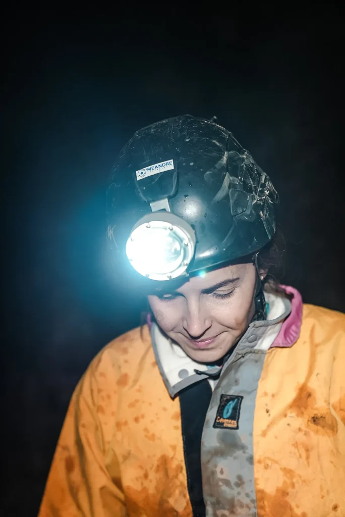 A woman caving in Malaval Cave