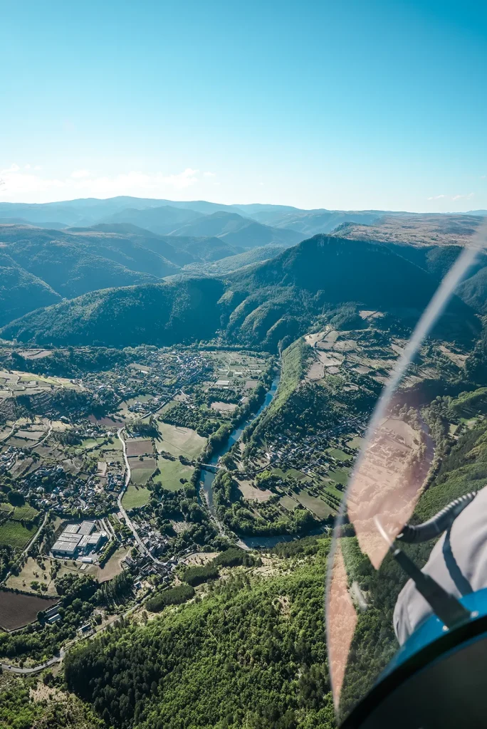 A microlight flying over Lozère